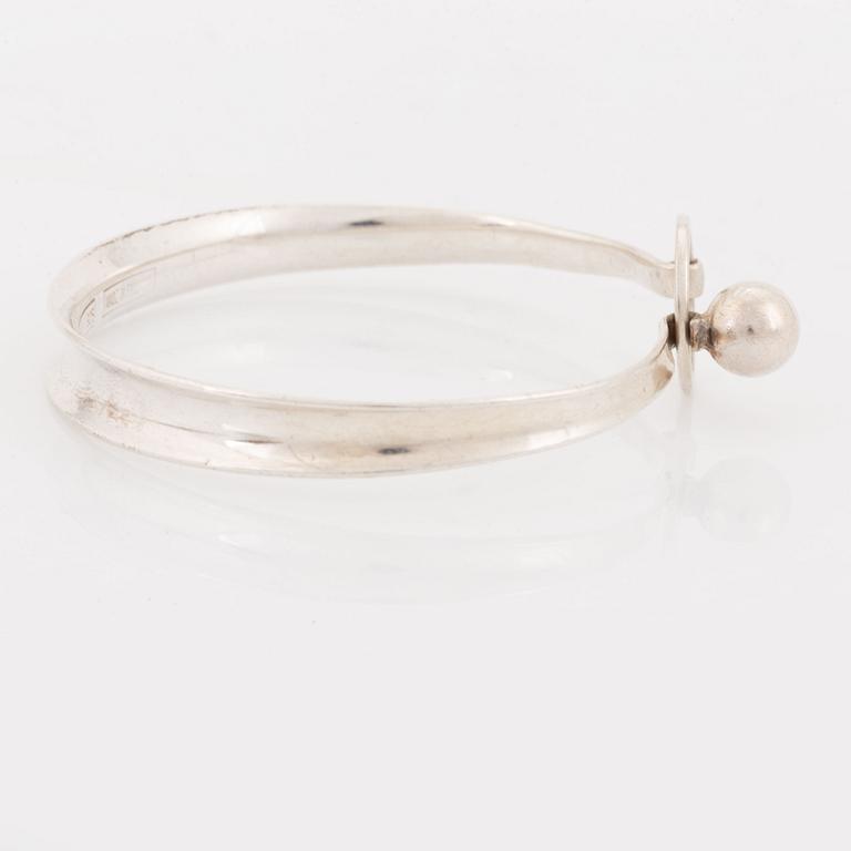 A silver Erik Granit bracelet.