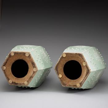 A pair of slip decorated celadon garden seats, Qing dynasty 19th century.