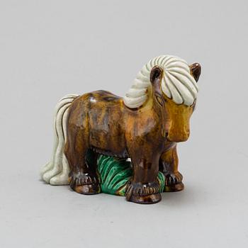 GUNNAR NYLUND, a chamotte stoneware figurine of a horse, from Rörstrand.