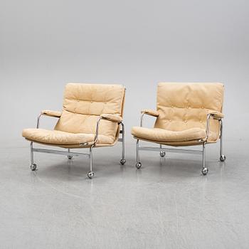 Bruno Mathsson, a pair of easy chairs and a coffee table, 'Karin', Dux, second half of the 20th Century.