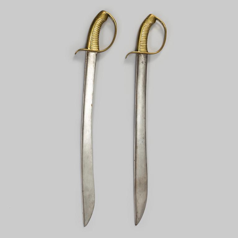 Two Swedish cutlasses 1846 pattern.