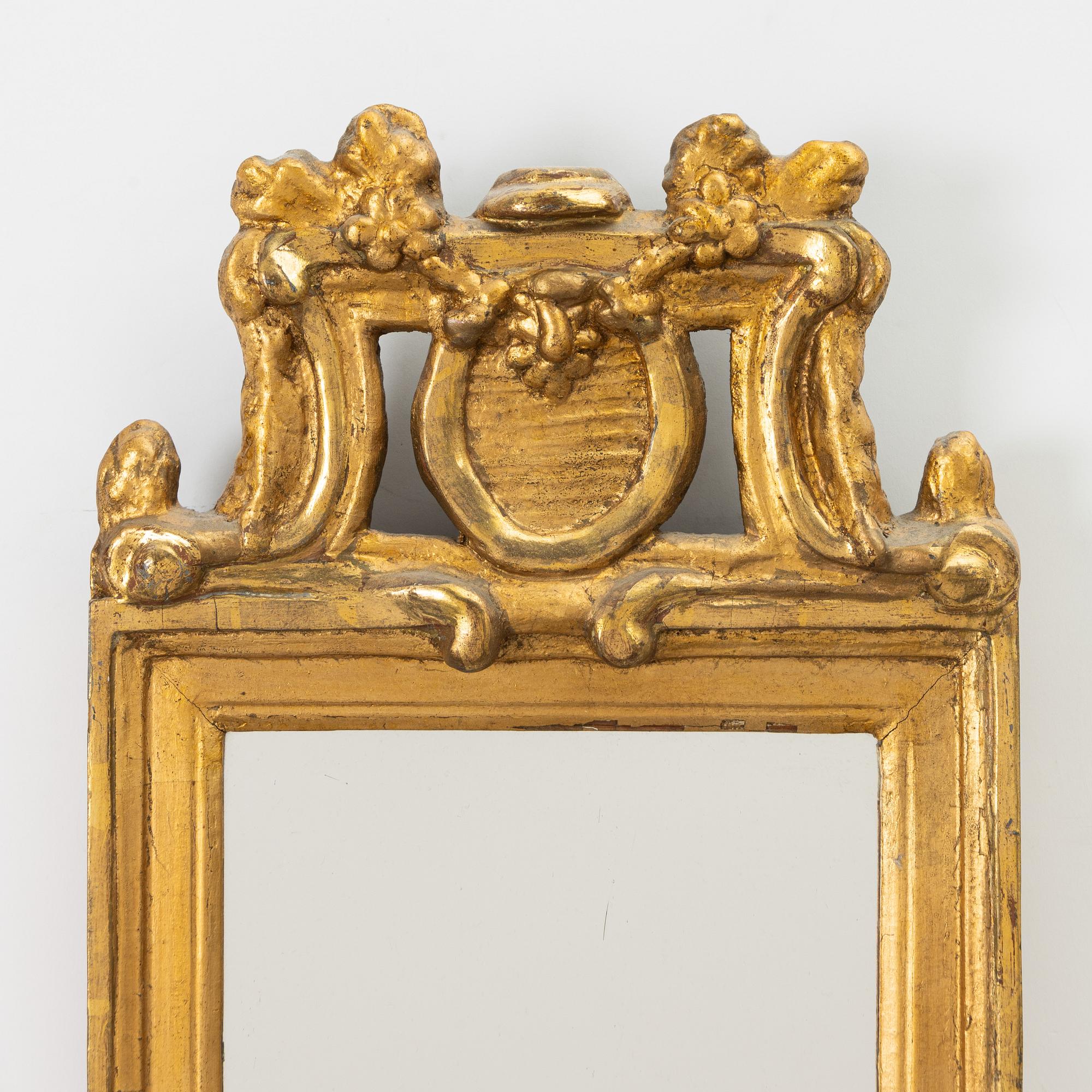 A Gustavian giltwood mirror, late 18th century.