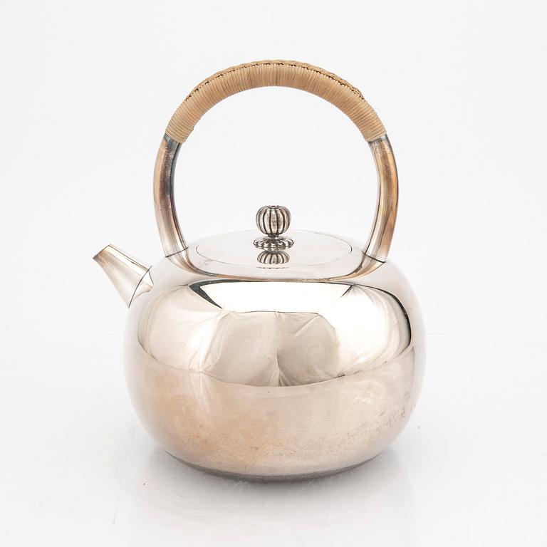 A Japanese early 20th century sterling silver tea pot.