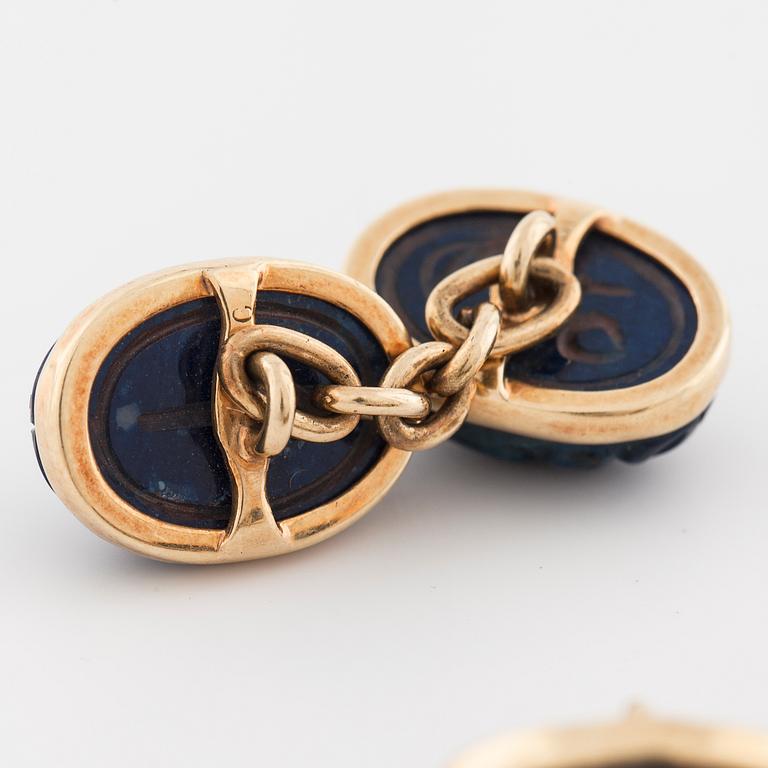 A pair of carved lapis lazuli cufflinks.