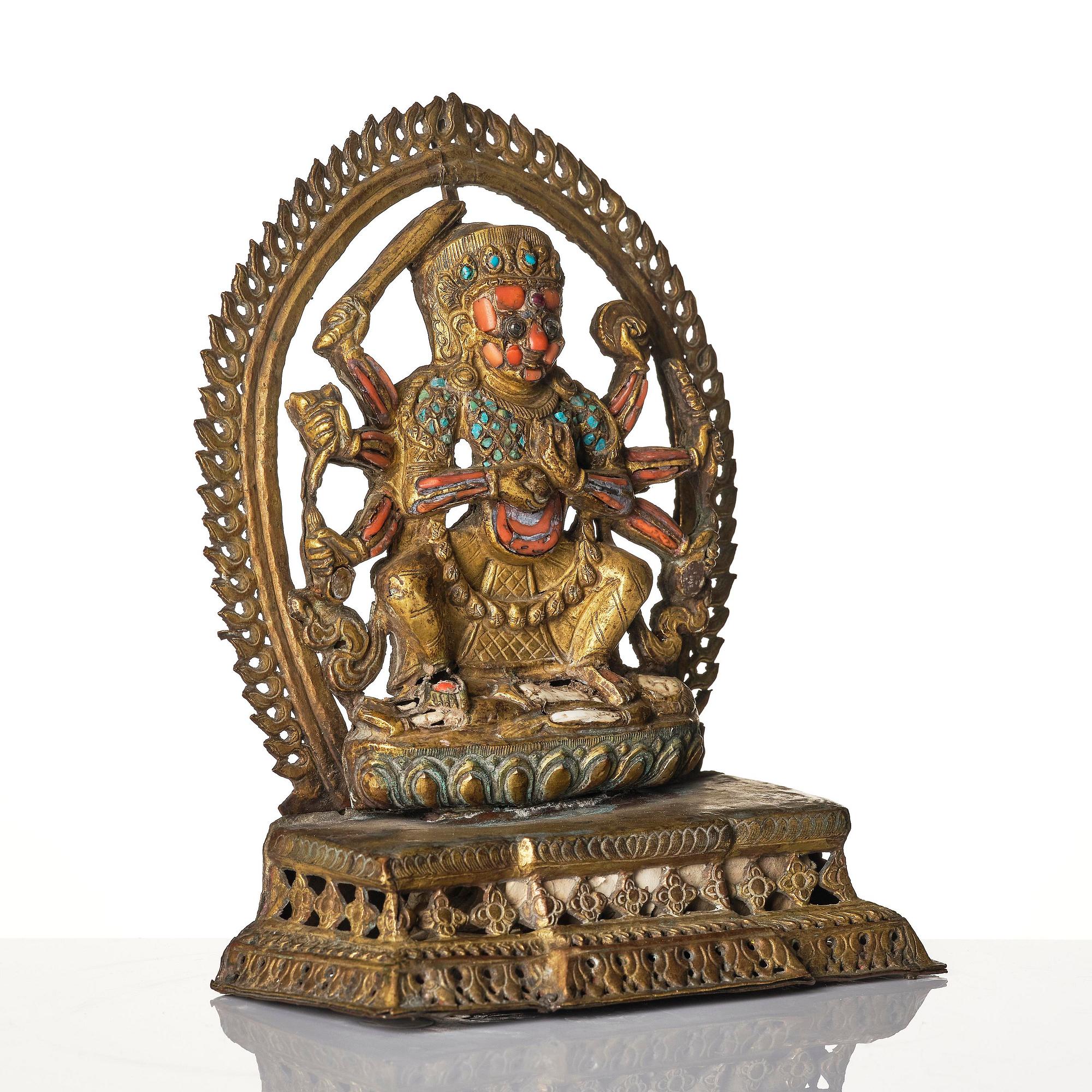 Gudom, förgylld kopparplåt med inläggningar. Nepal, omkring 1900.