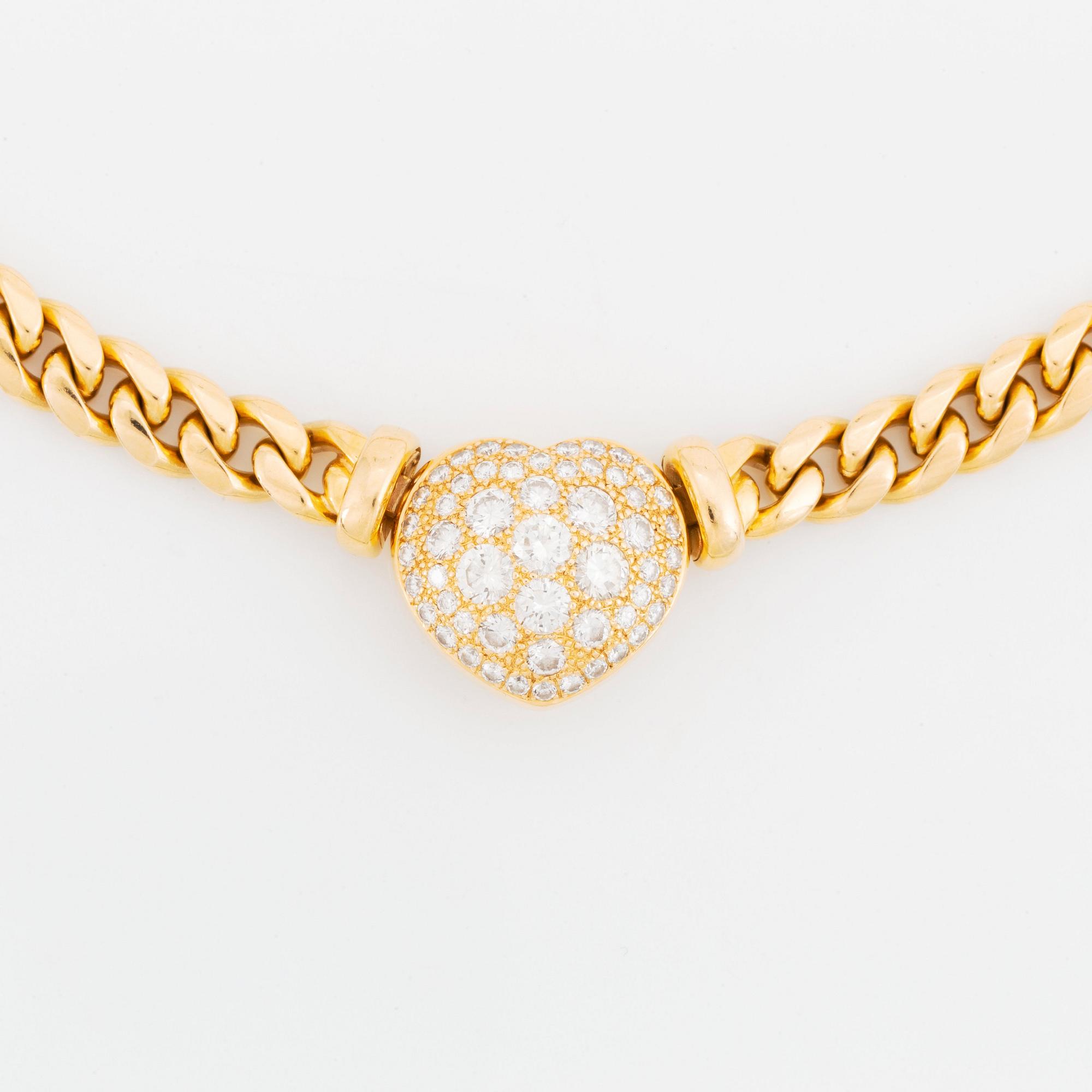An 18K gold necklace set with round brilliant-cut diamonds.
