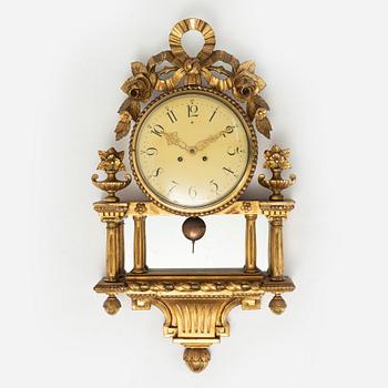 A  late Gustavian style wall clock, early 20th century.