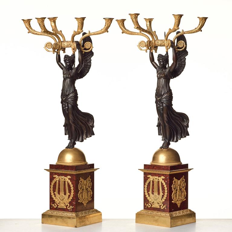 A pair of important five light Empire candelabra.