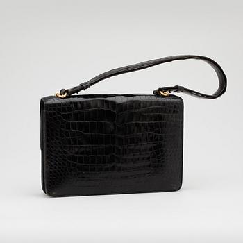 HERMÈS, a black crocodile leather shoulder bag.