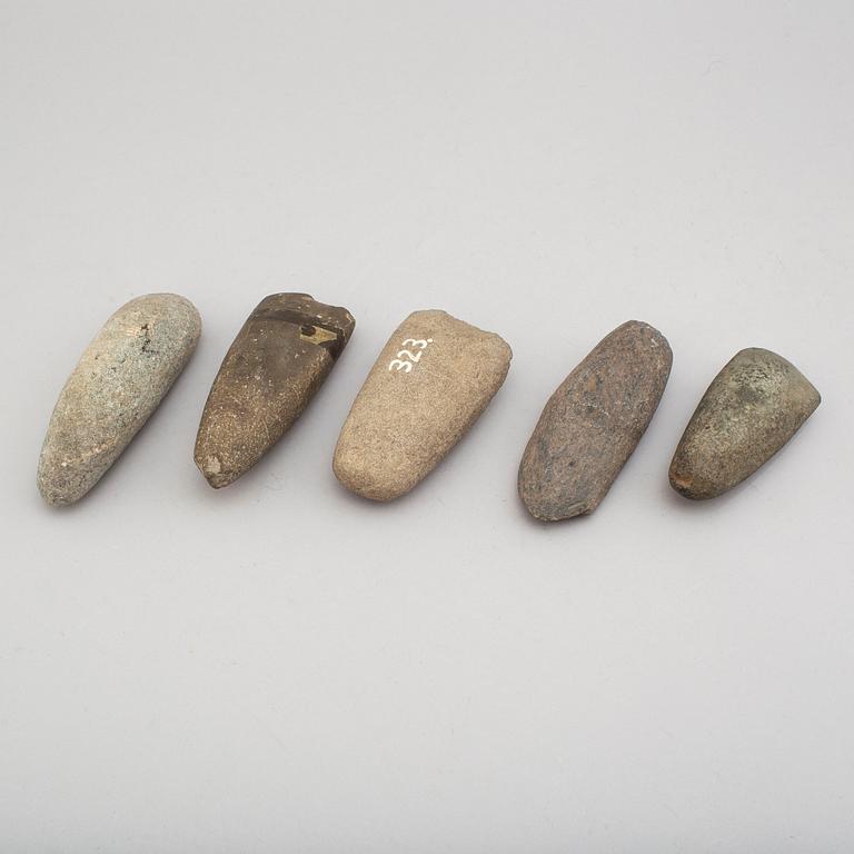 Five neolithic stone axes.