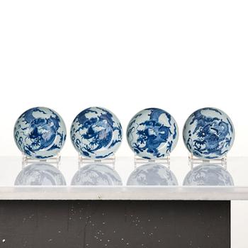 A set of four blue and white dragon dishes, Qing dynasty, 18th Century.