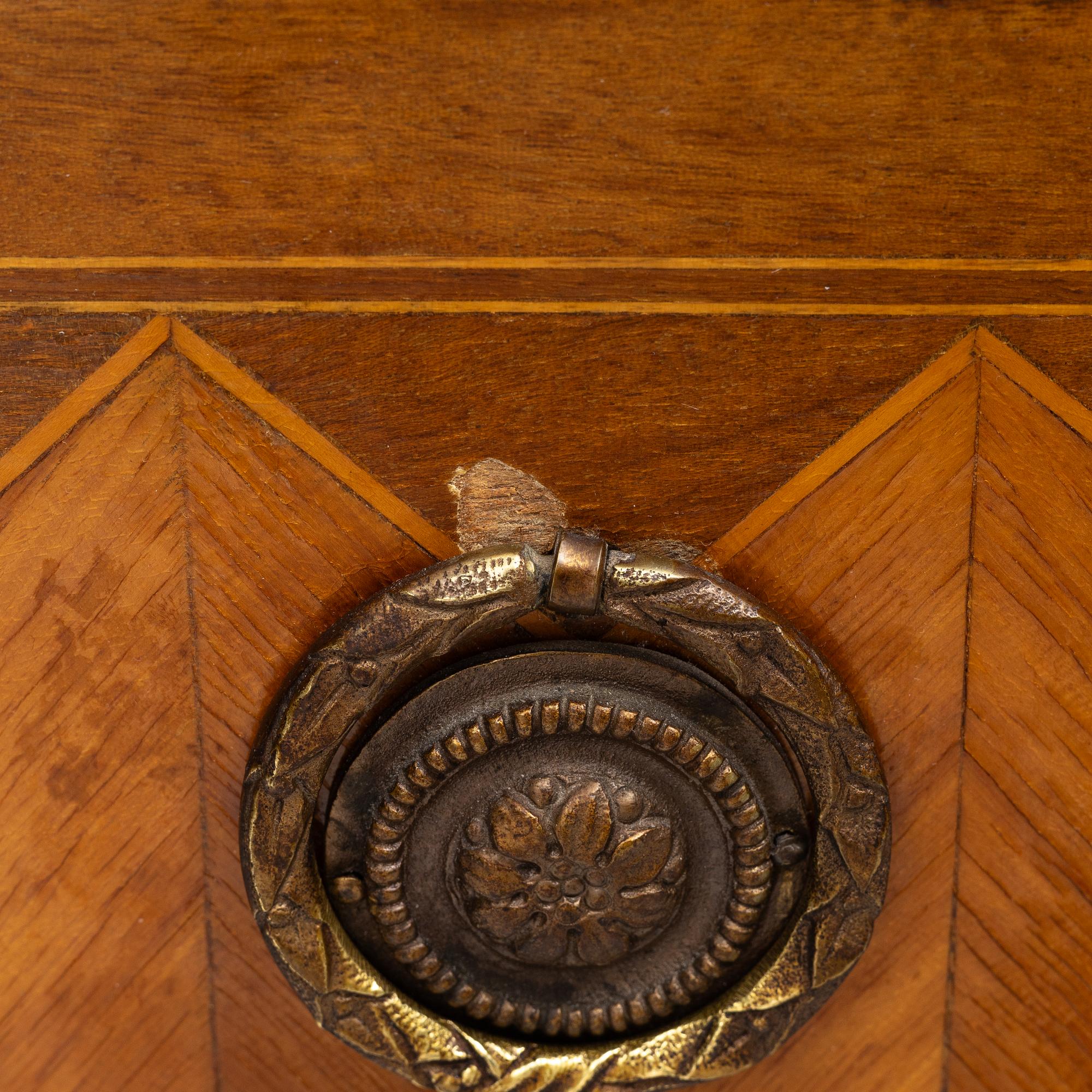 A Louis XVI style chest of drawers, France, circa 1900.