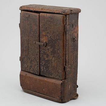 AN ALMSBOX/ALTAR CUPBOARD, painted wood, probably 17th century.