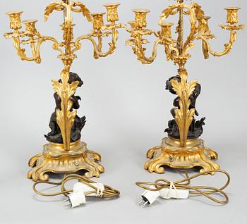 A pair of  mid 19th century, rococo-style TABLE LAMPS/CANDELABRA.