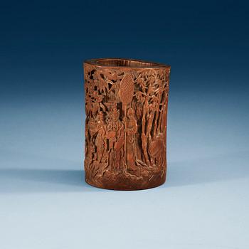 A carved bambu brush pot, late Qing dynasty.