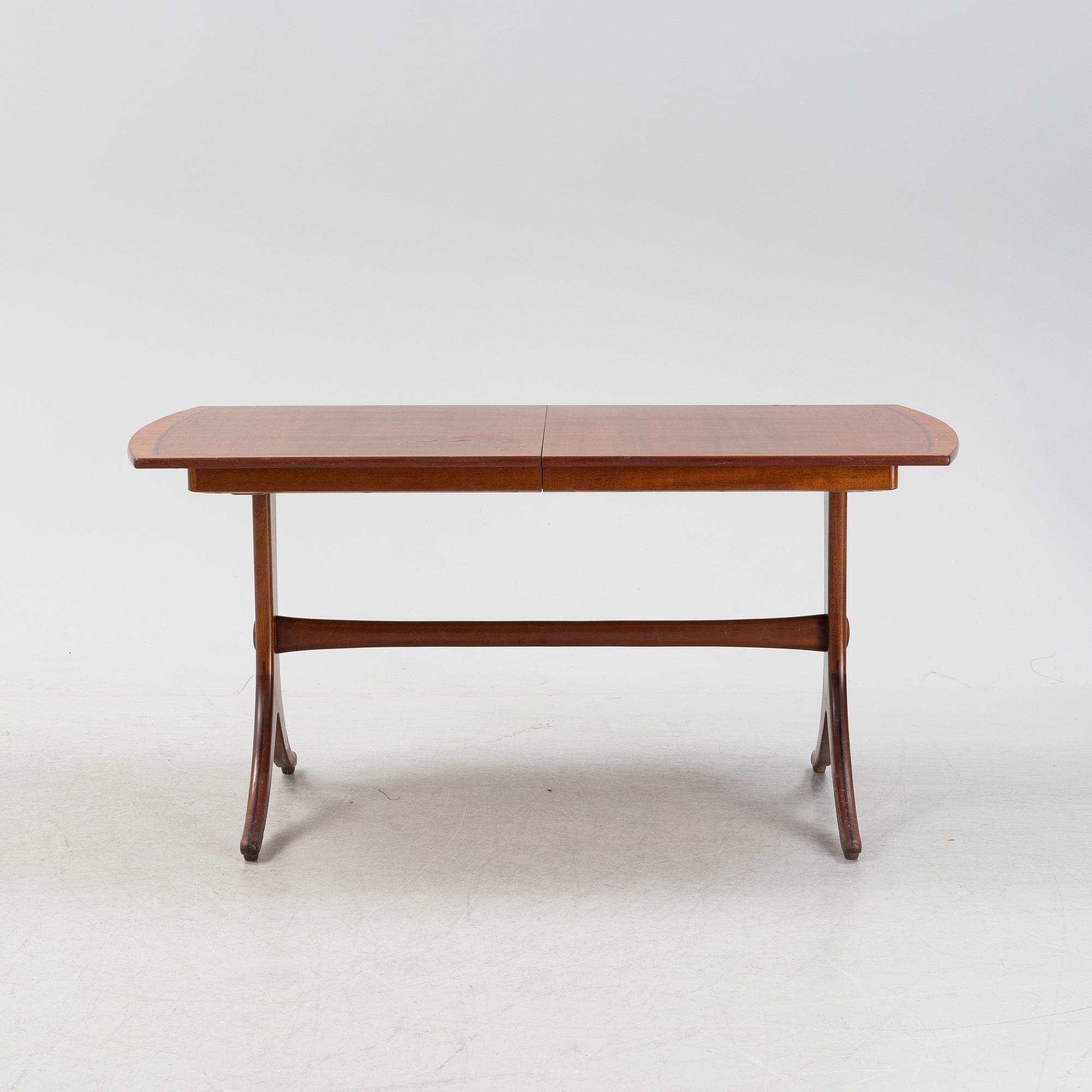 A mahogany and rosewood veneered dining table, mid 20th Century.
