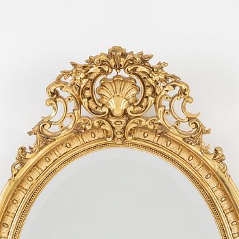 A Rococo style mirror, first half of the 20th Century.