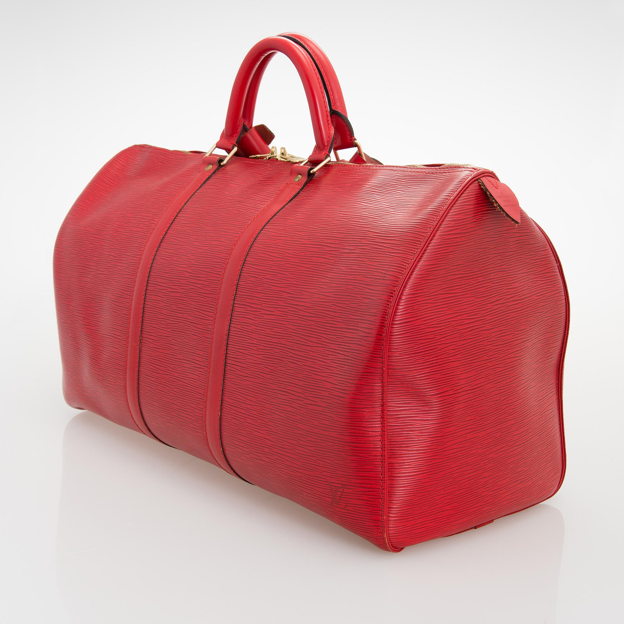 Louis Vuitton, A Red Epi Leather Keepall travel bag.