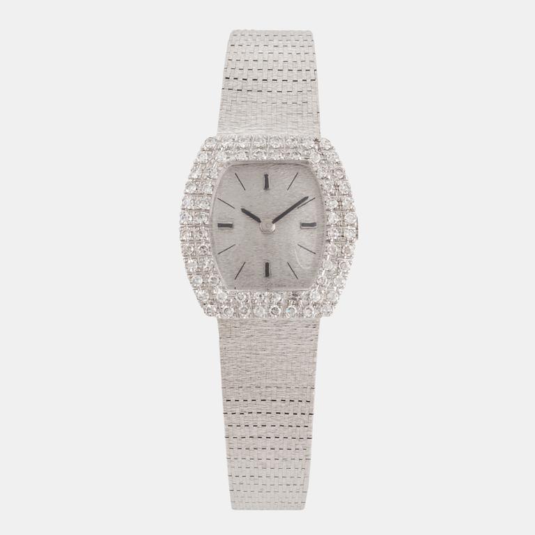 An 18K white gold and eight cut diamond Venus ladies watch.