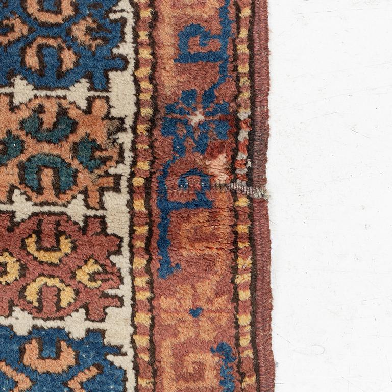 Rug, likely Kurdish, circa 1900, approximately 314 x 156 cm.