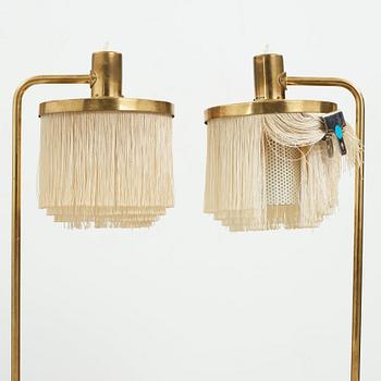 Hans-Agne Jakobsson, a pair of brass and tassel floor lamps for Markaryd AB Sweden, 1960-70's.