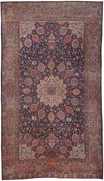 A CARPET. A semi-antique Kerman. 614,5 x 360,5 cm.