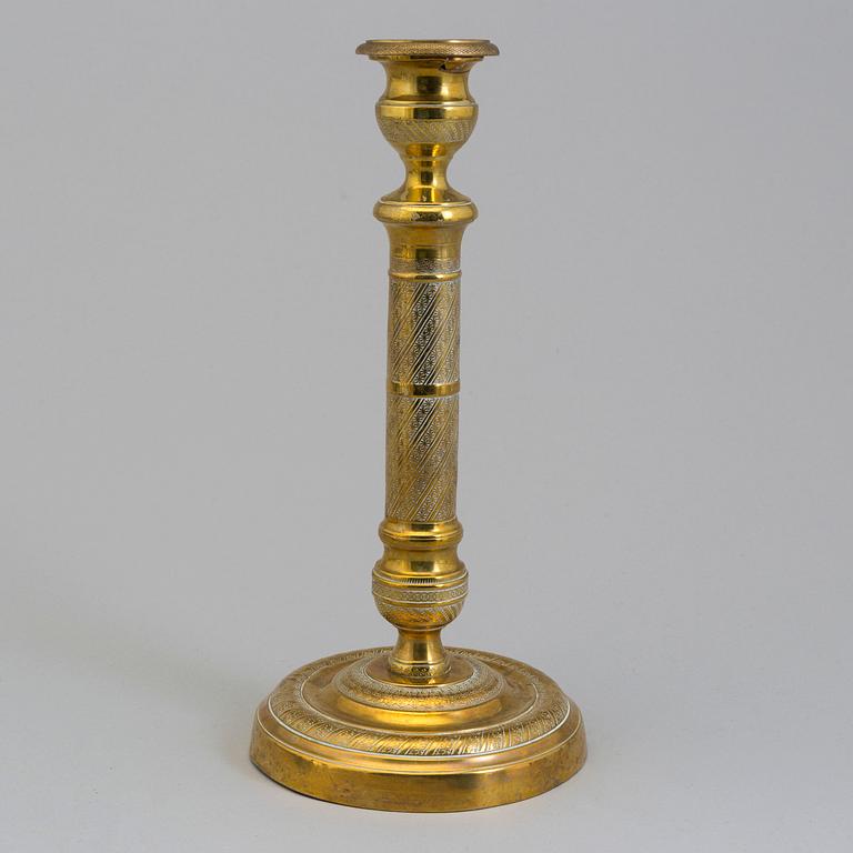 AN EMPIRE ORMOLU CANDLESTICK, first half of the 19th century.