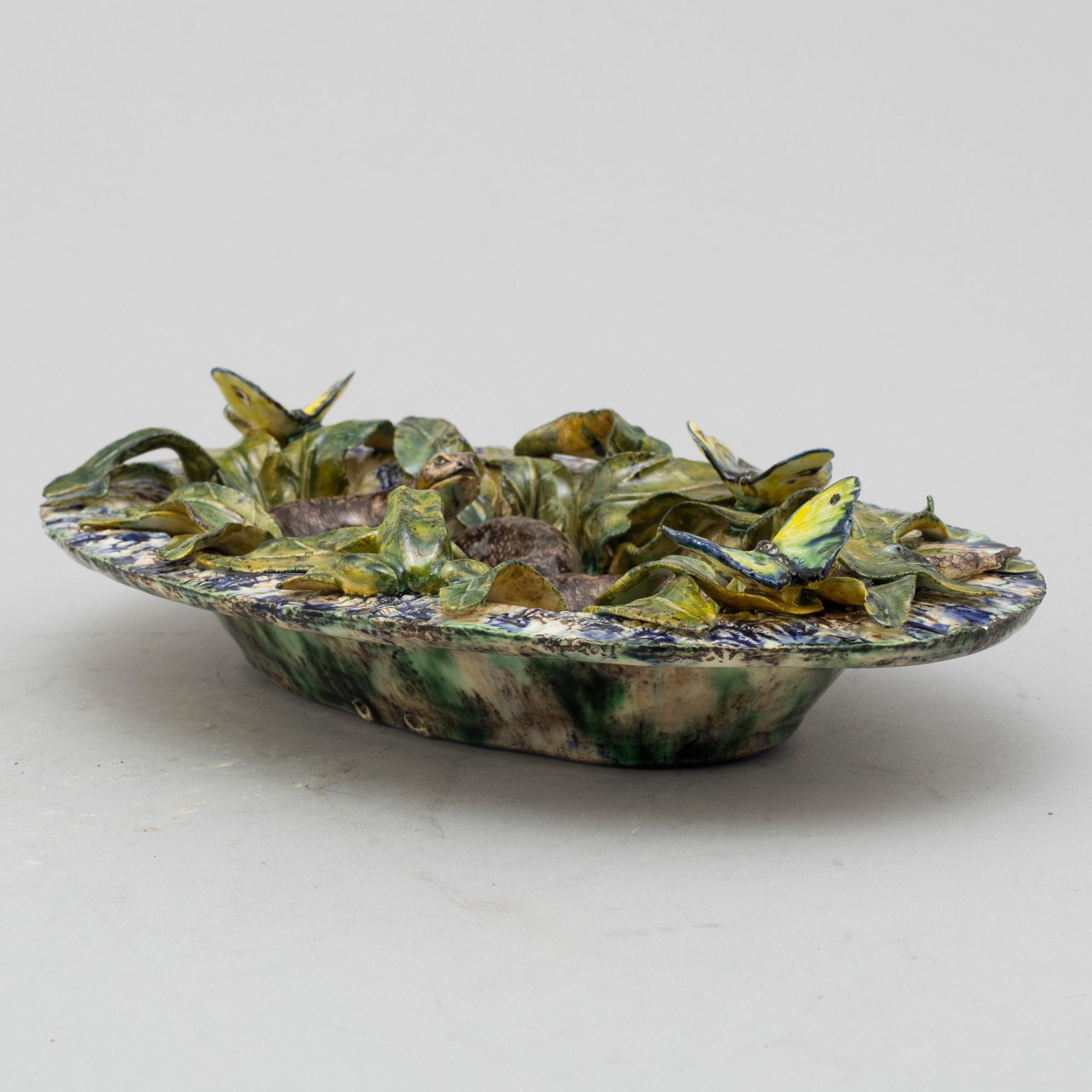 A richly decorated Palissy-style majolica plate, 19th century.