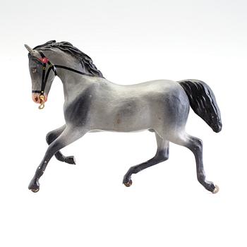 A painted tinplate toy horse ca year 1900.