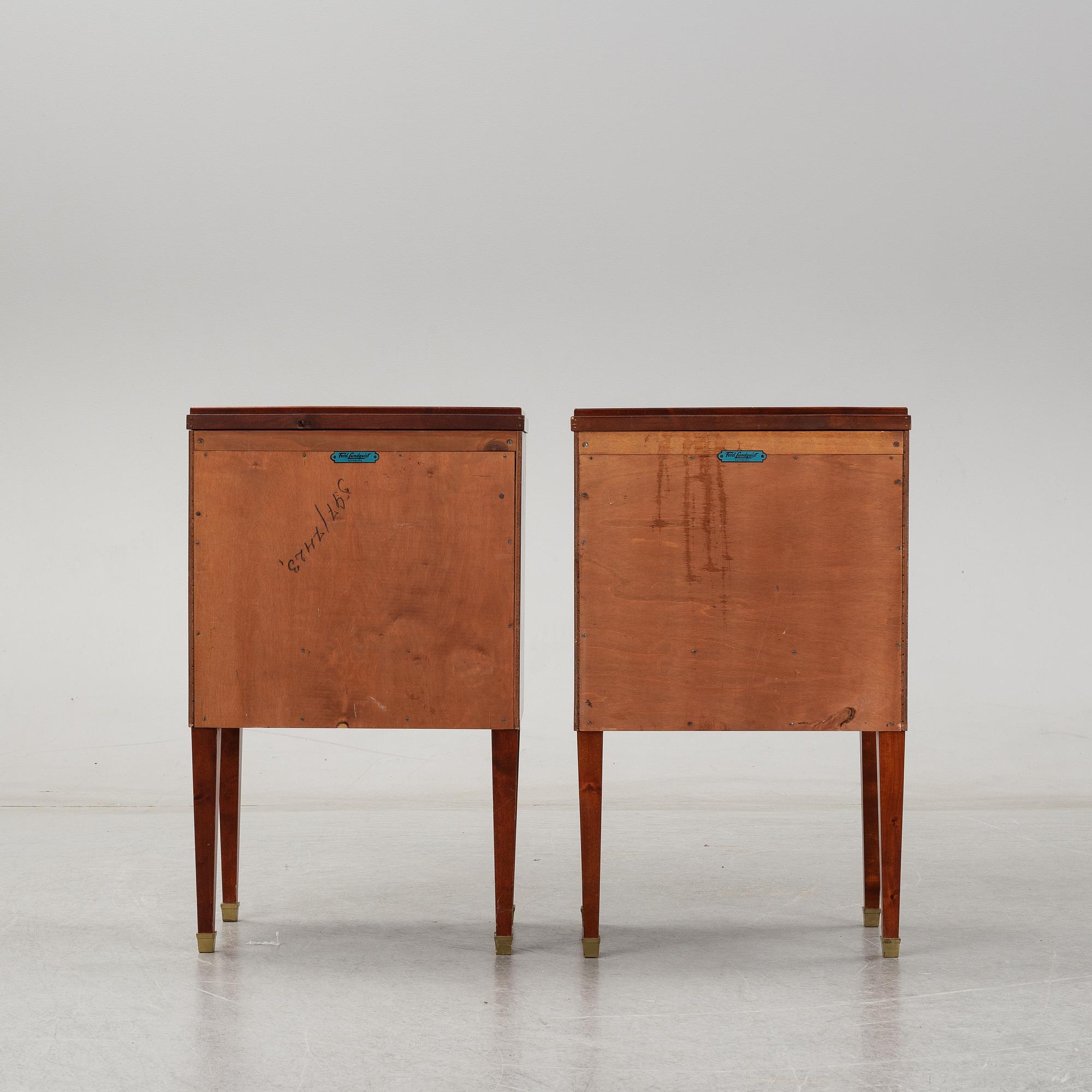 A pair of mahgany veneered bedside cabinets, early 20th Century.