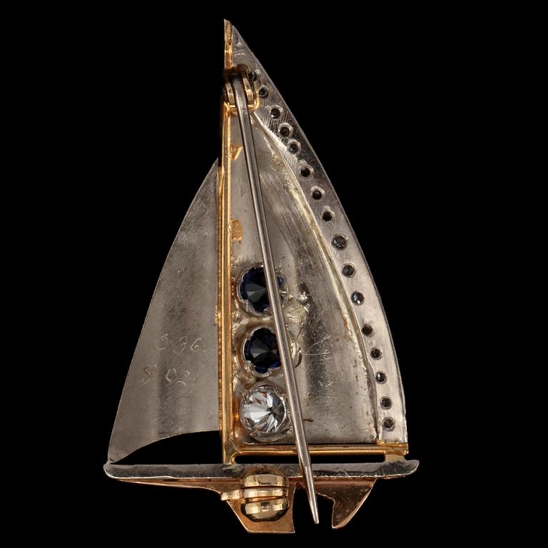 BROSCH, 18k guld och vitguld med 17 briljantslipade diamanter tot 0.36 ct och 2 blå safirer 0.21 ct, Göteborg. Vikt 5 g.