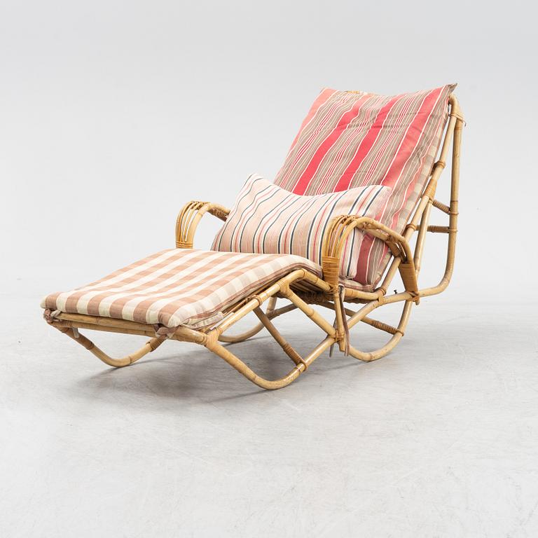 A rattan lounge chair from the secnd half of the 20th century.