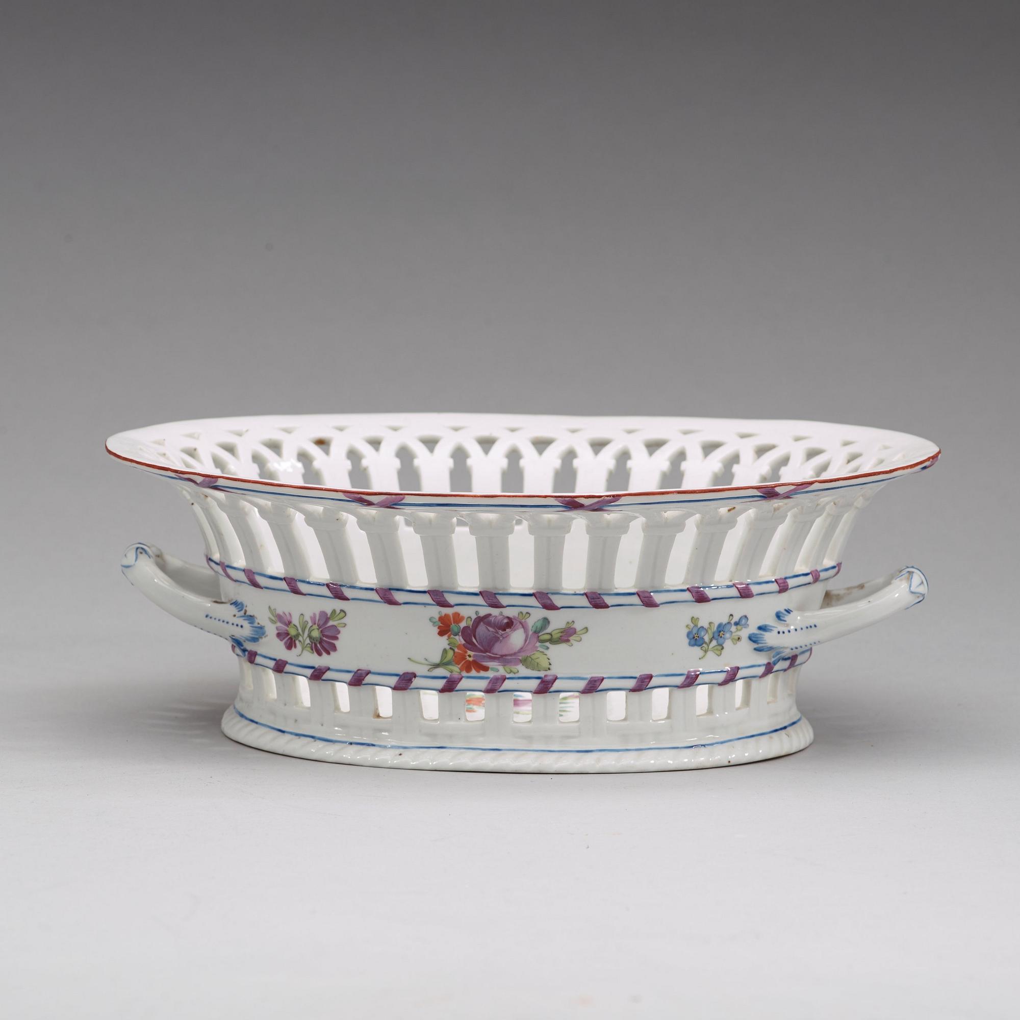 A Russian chesnut basket and stand, Imperial Porcelain Manufactory, St Petersburg, period of Alexander I (1801-25).