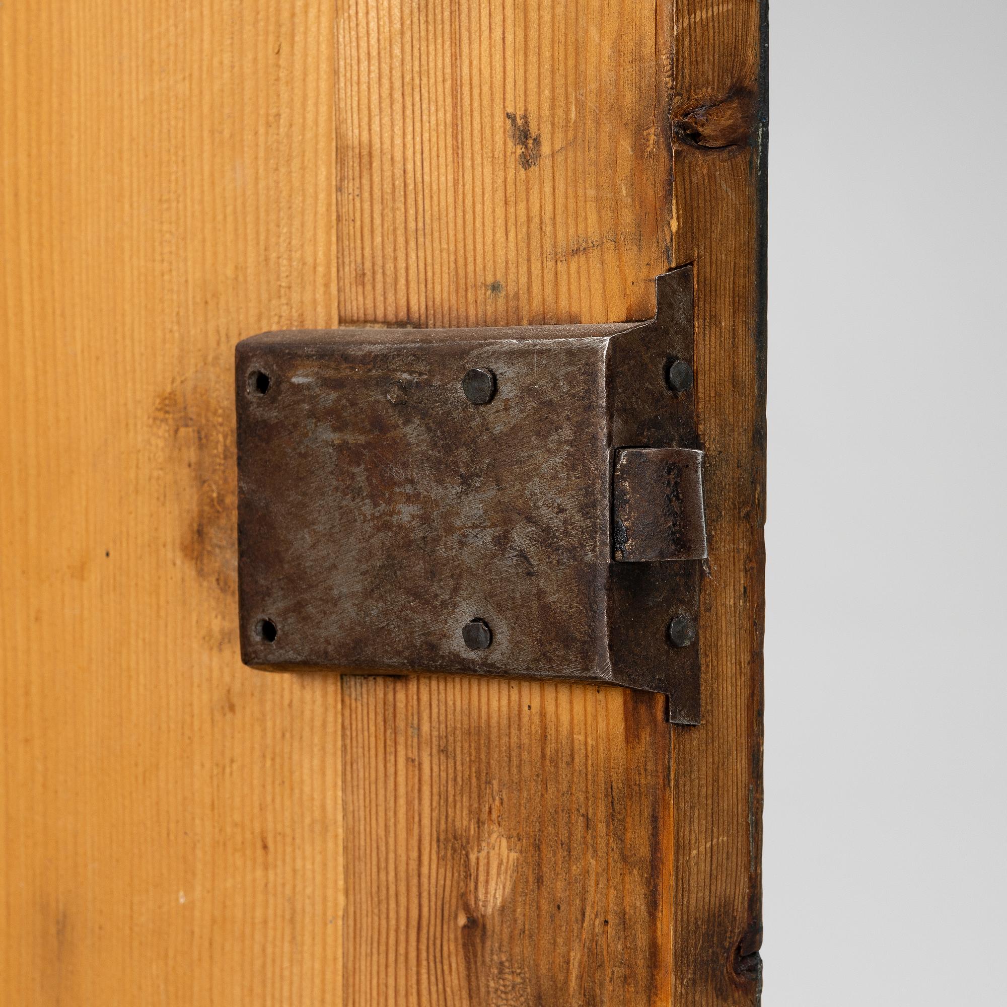 A folk art corner cabinet from Delsbo, Hälsingland, dated 1865.