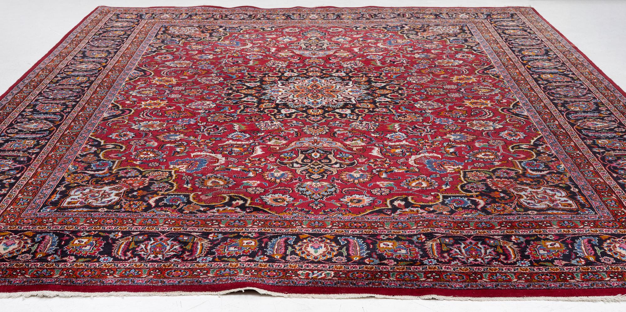 An Oriental carpet, approx. 380 x 304 cm.