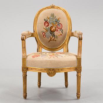 A Gustavian style arm chair, first half ot the 20th Century.