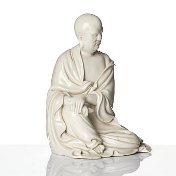 A blanc de Chine seated figure of Bodhidharma, Qing dynasty.