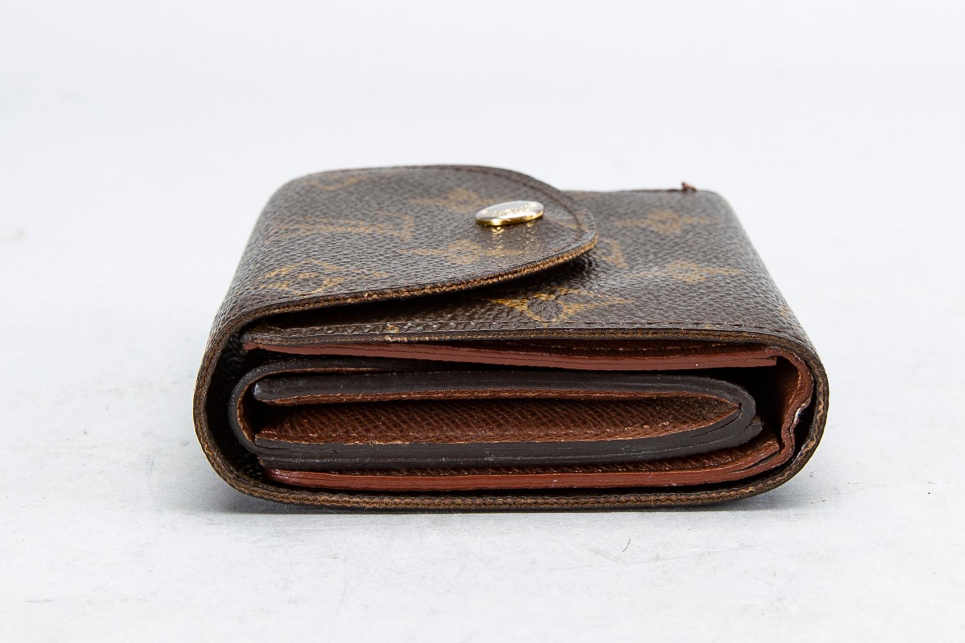 An 'Helene' wallet by Louis Vuitton.