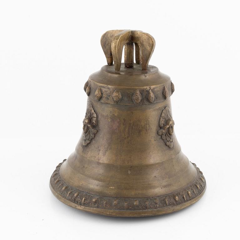 A brass gruel bell, dated 1879.