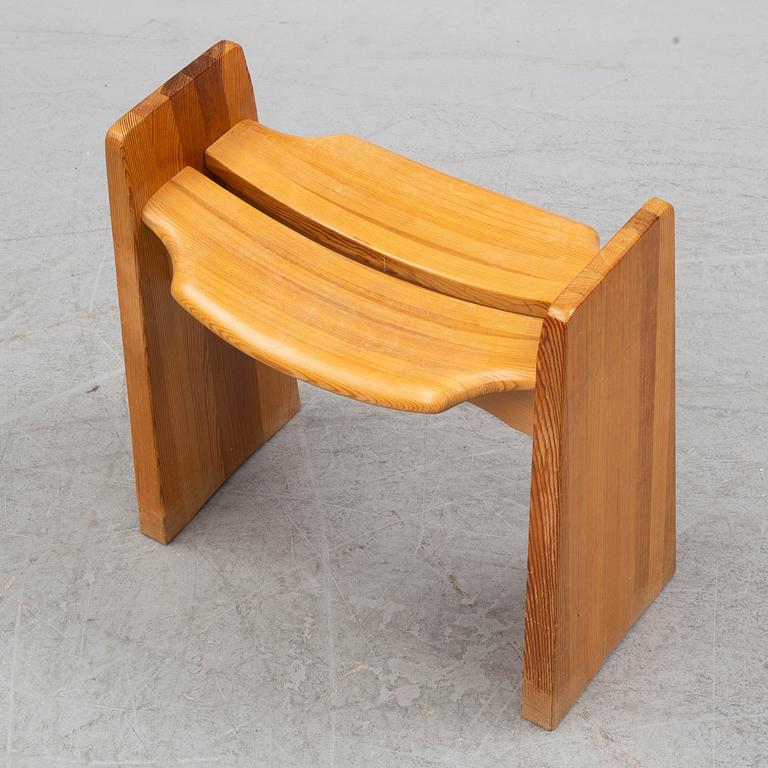 A pine bench by Gilbert Marklund.