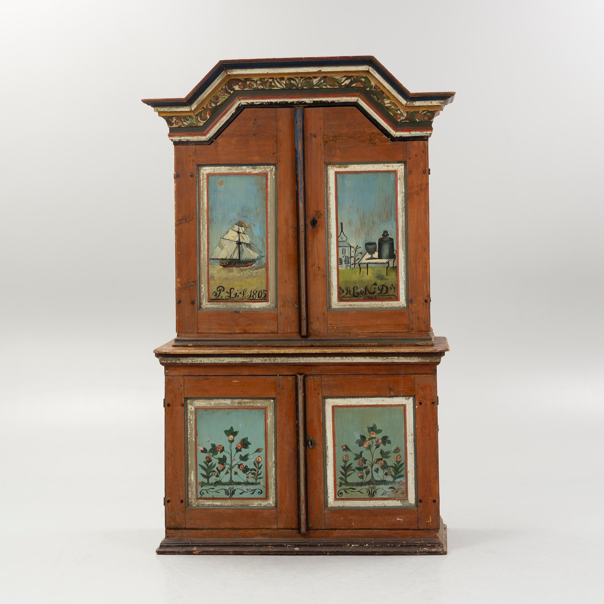 A Swedish polychrome.-painted cabinet, presumably from Halland, dated 1805.