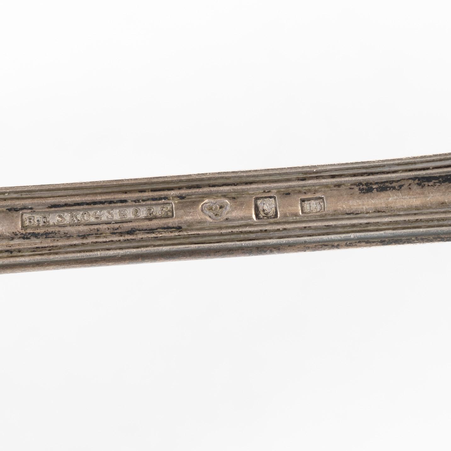 A Swedish silver gilt spoon, and a silver serving spoon, 18-19th Century.