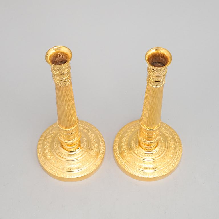 A pair of french Empire candlesticks, first half of the 19th Century.