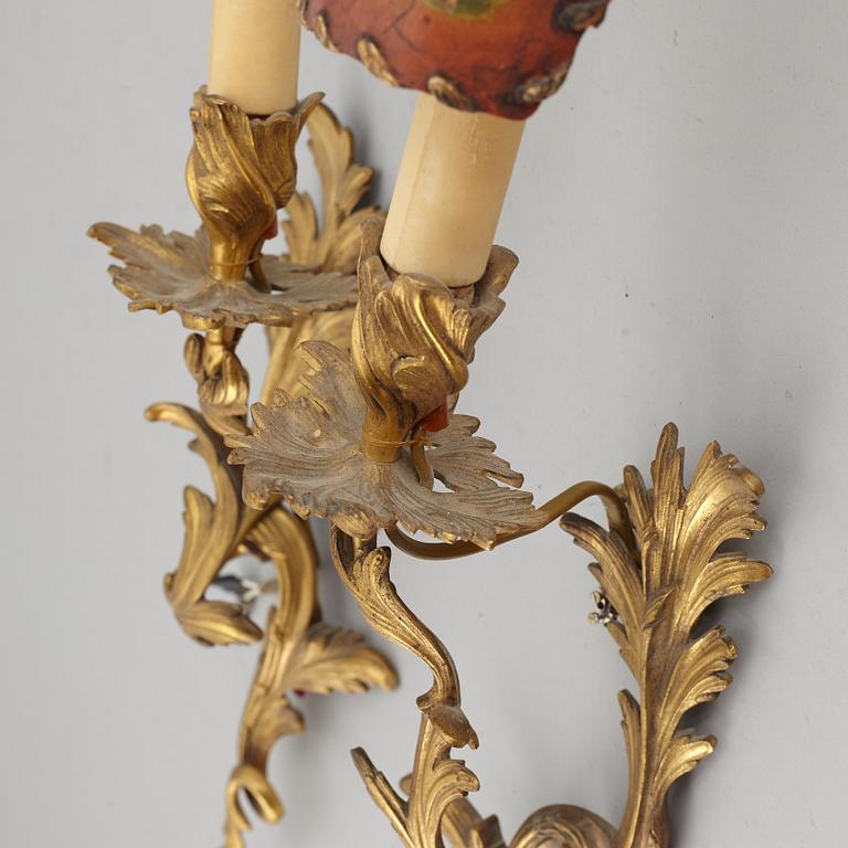 A pair of Louis XV style 20 th Century wall sconces.