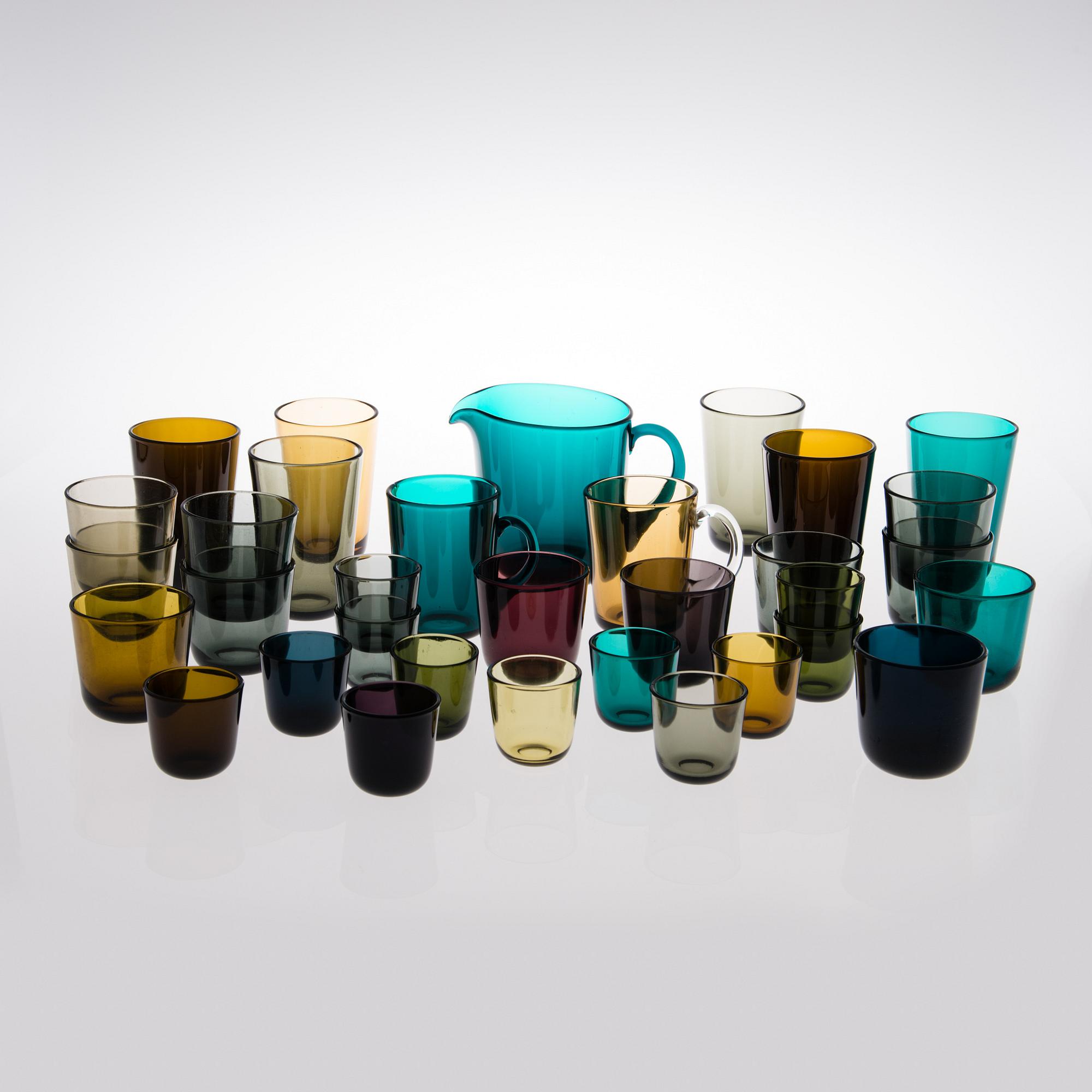 A set of 32 glasses and a pitcher in pressed glass, Nuutajärvi Finland.