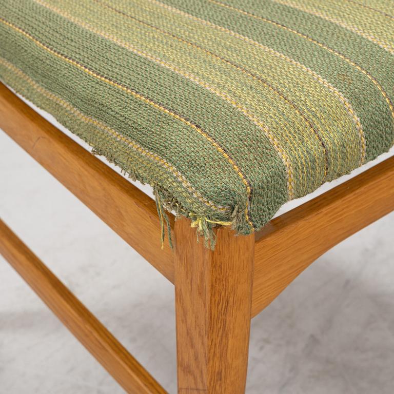 Carl Malmsten, a dining table and four chairs, 'Calmare nyckel', Åfors Möbelfabrik, second half of the 20th century.