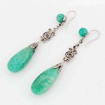 A pair of platinum earrings with amazonite.