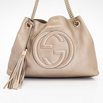 Gucci, a "Soho" leather bag.