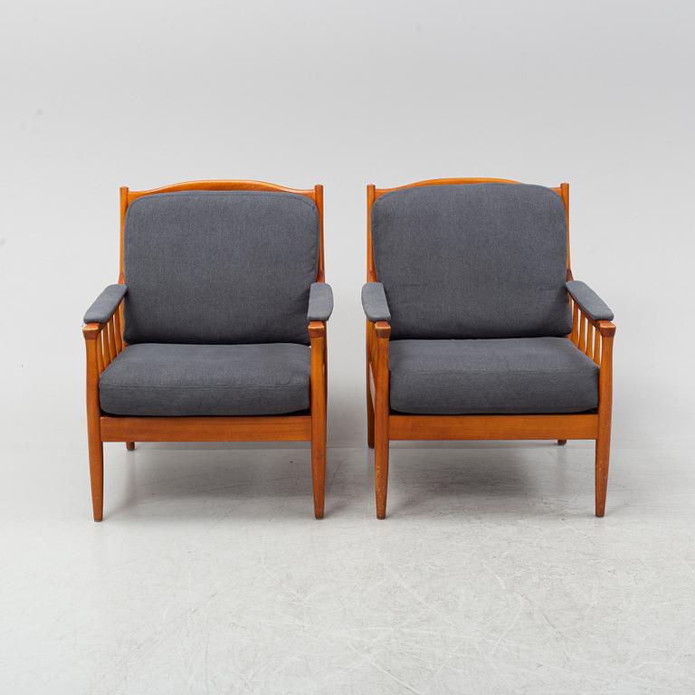 A pair of Swedish stained beech easy chairs, second half of the 20th Century.