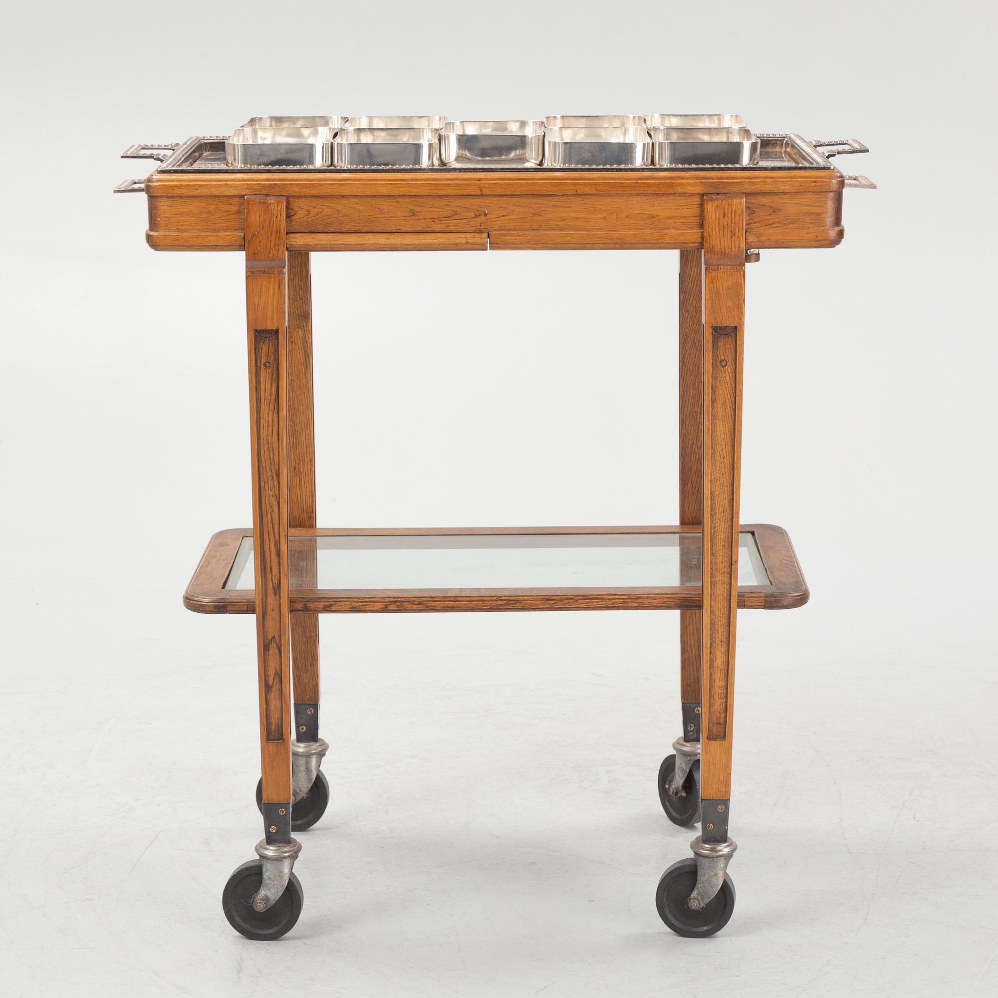 A restaurant serving trolley with silver plate dishes, first half of the/mid 20th century.